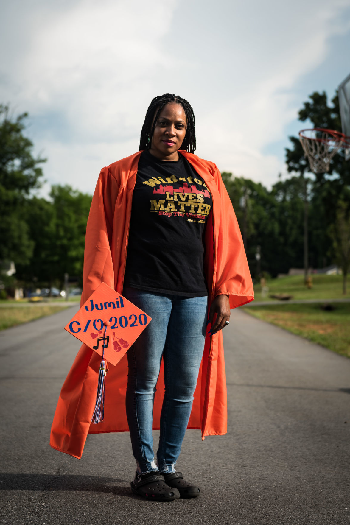 Nakeshia Collins accepts Glenn diploma for son Jumil Robertson